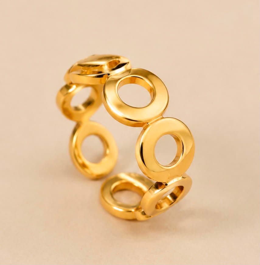 Adjustable multi loop gold ring